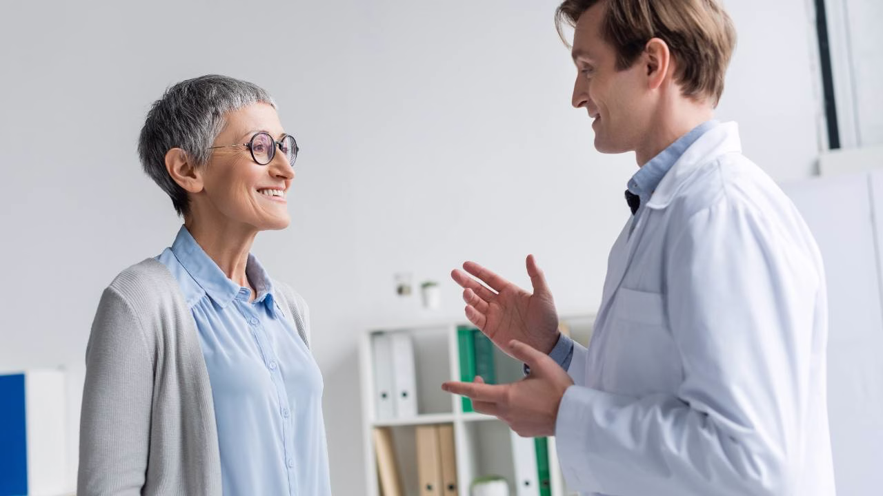 Surgeon explaining surgical fees and known-gap cover to a patient
