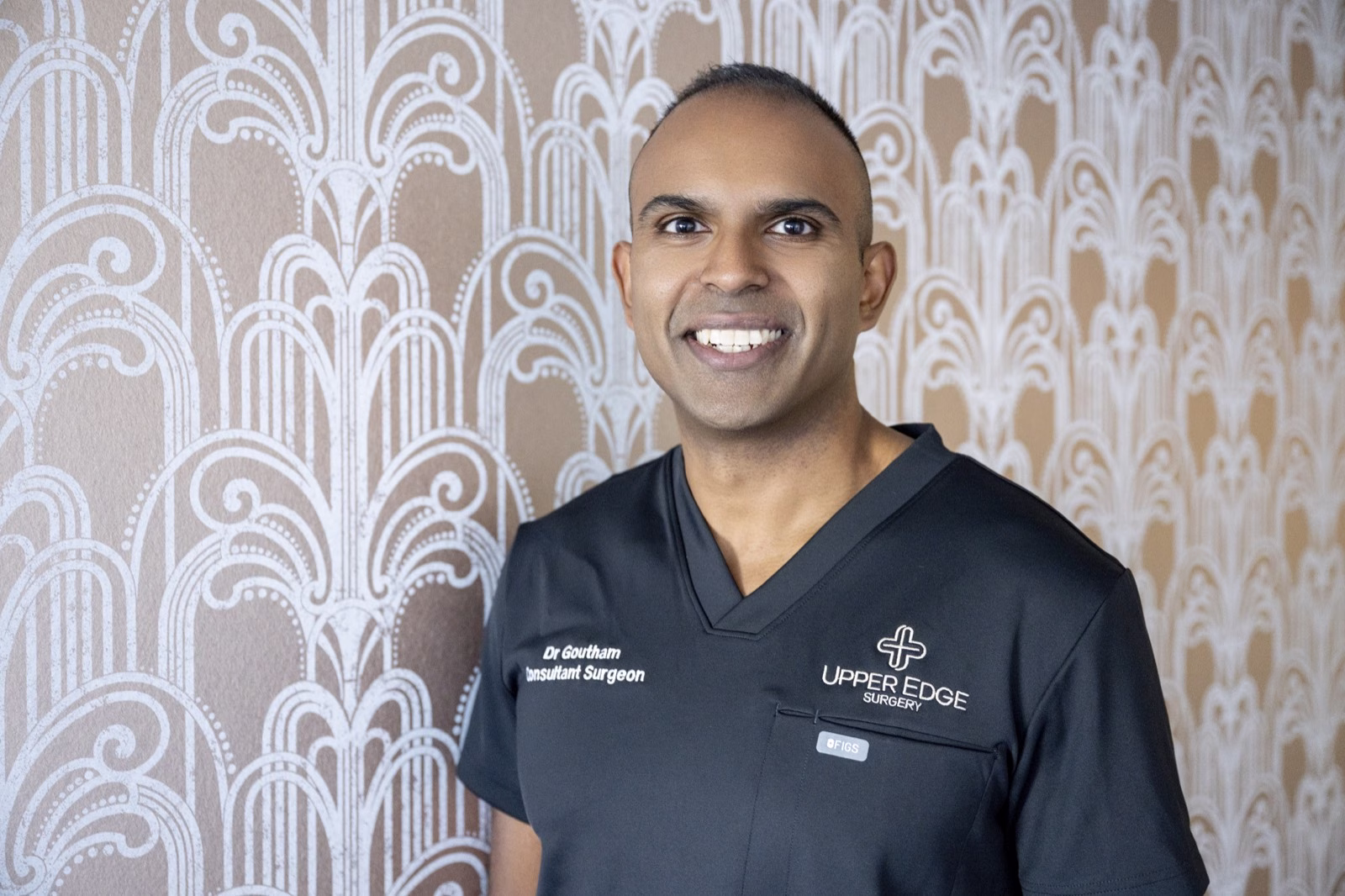 Dr Goutham Sivasuthan in Upper Edge Surgery scrubs at Watkins Medical Centre
