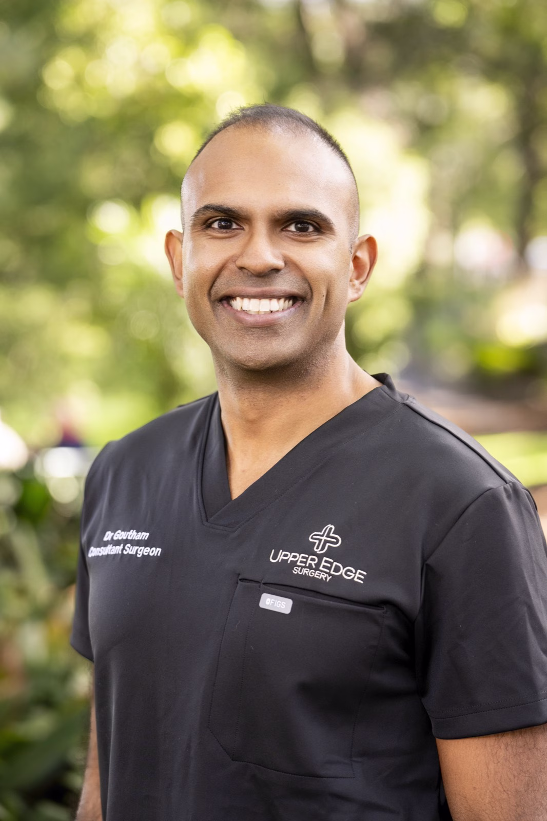 Dr Goutham Sivasuthan wearing Upper Edge Surgery scrubs outdoors